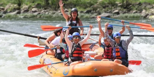 A group of people white water rafting at New River Gorge National Park and Preserve